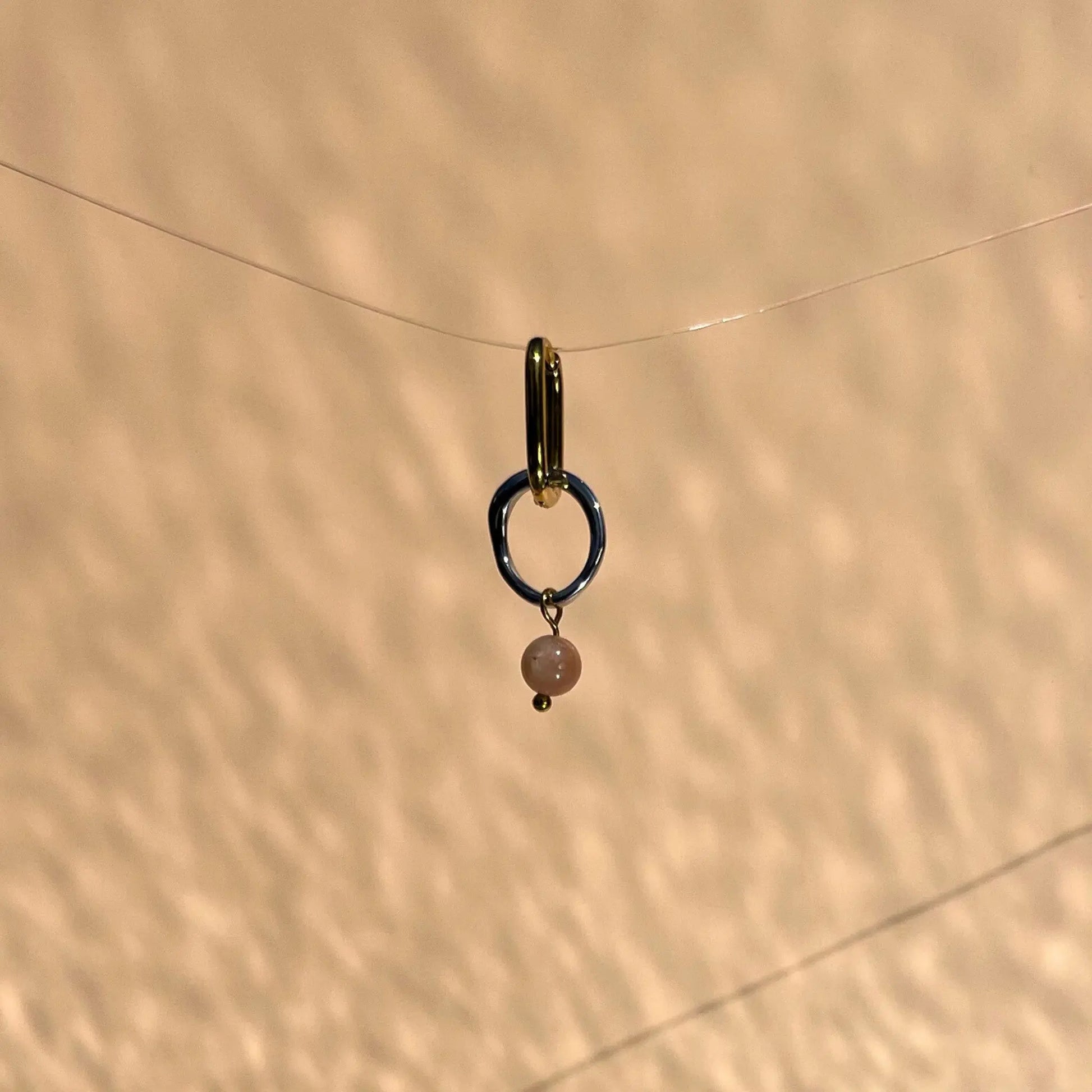 boucle d'oreille en acier inoxydable et pierre de soleil